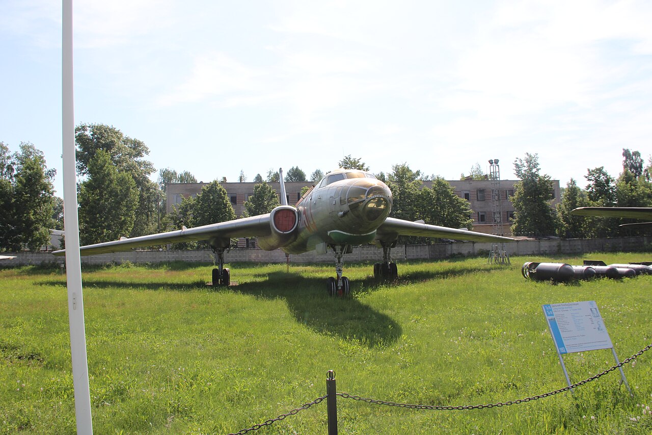 Tu-16R viewed from the front at Monino, with a glazed nose, engines at the wing roots, swept wings and tall tail fin; a narrow foreground pole overlaps part of the left wing.