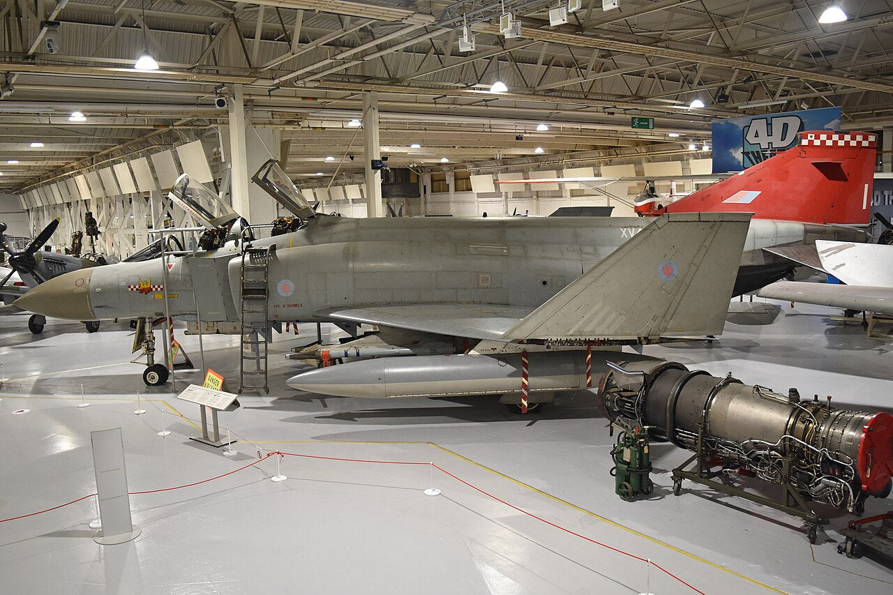 Side view of Phantom FGR2 XV424 in a museum hangar, with its cockpit canopies open.