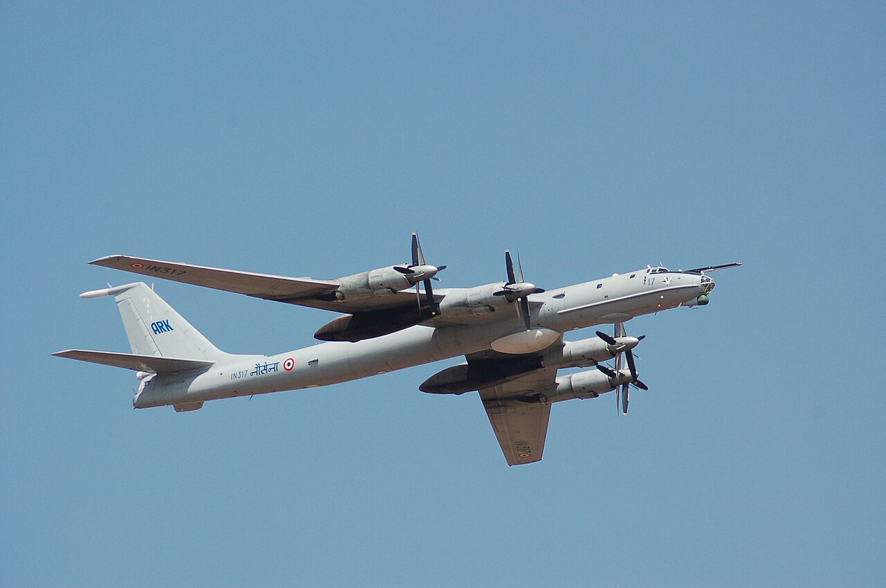 Indian Navy Tu-142 IN317 in flight, with four propeller engines, swept wings and long fuselage fully in frame.